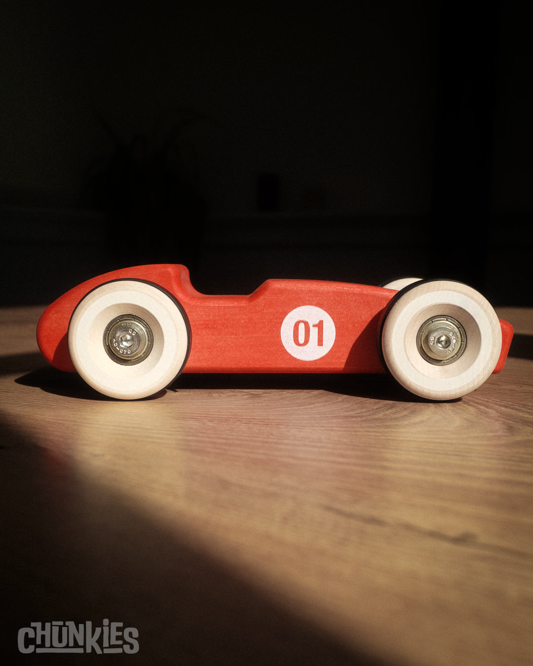 Chunkies: Bright red wooden toy car in the shape of a vintage 1956 Ferrari F1 car with wooden wheels, skate bearings and stainless steel hardware. Built to last generations.