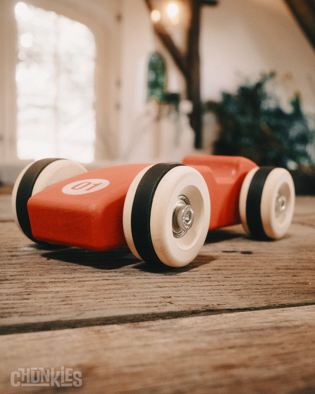 Chunkies: Bright red wooden toy car in the shape of a vintage 1956 Ferrari F1 car with wooden wheels, skate bearings and stainless steel hardware. Built to last generations.