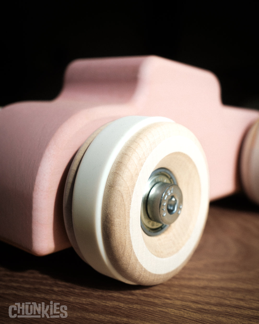 Chunkies: Perfectly PInk wooden toy car in the shape of a vintage hot rod with wooden wheels, skate bearings and stainless steel hardware. Built to last generations. 