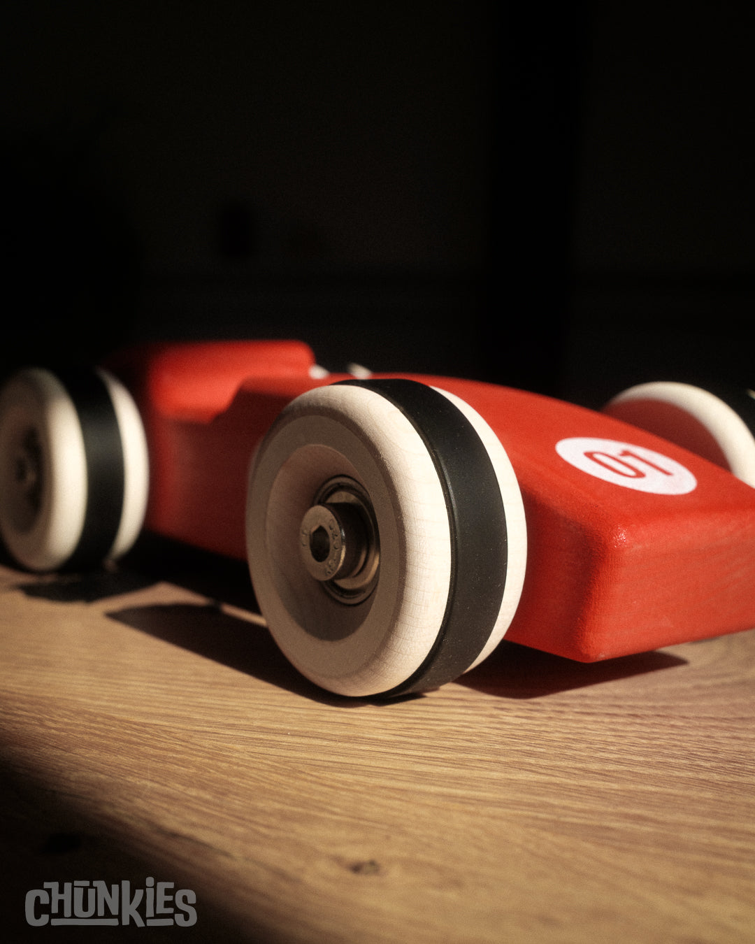 Chunkies: Bright red wooden toy car in the shape of a vintage 1956 Ferrari F1 car with wooden wheels, skate bearings and stainless steel hardware. Built to last generations. 