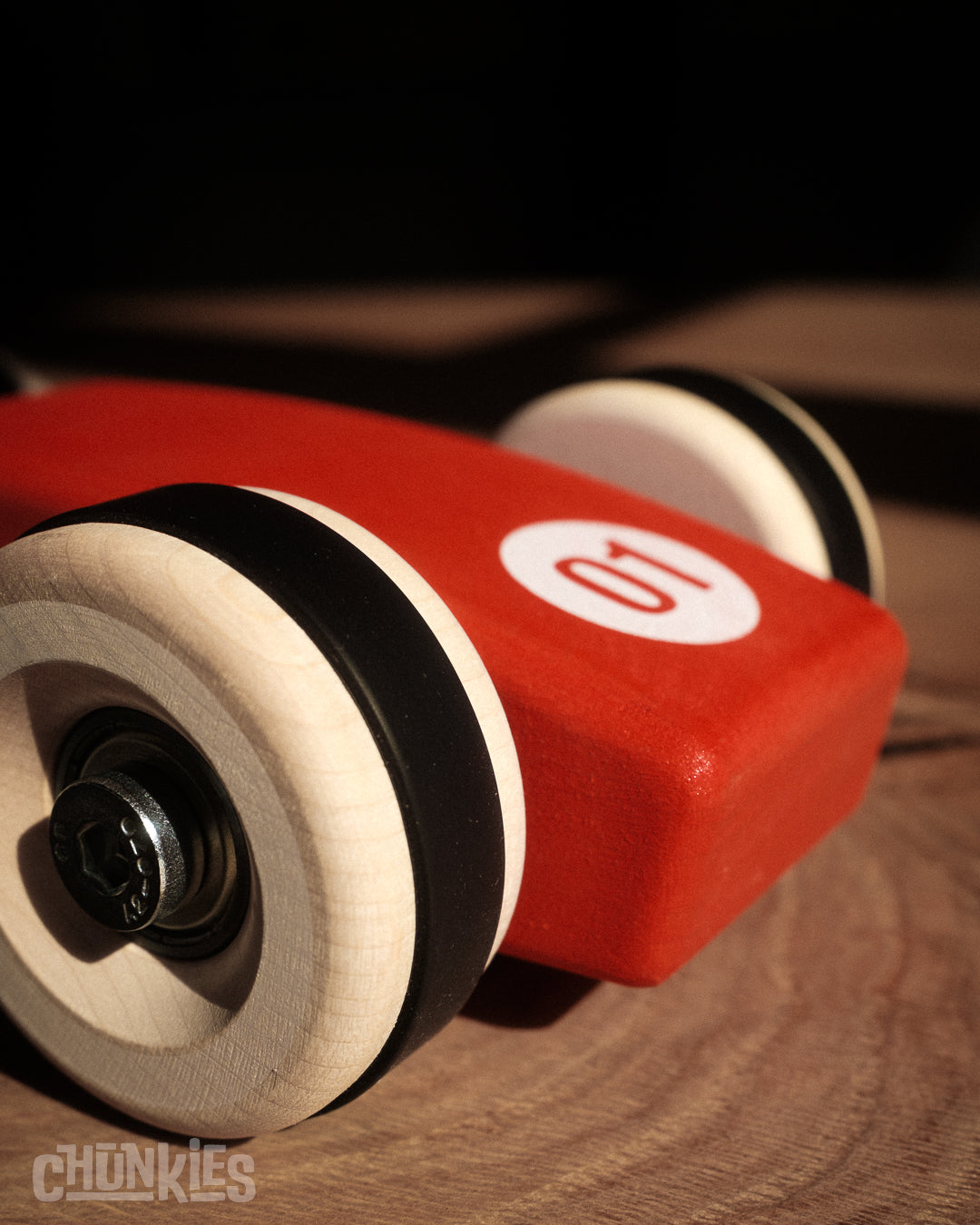 Chunkies: Bright red wooden toy car in the shape of a vintage 1956 Ferrari F1 car with wooden wheels, skate bearings and stainless steel hardware. Built to last generations. 