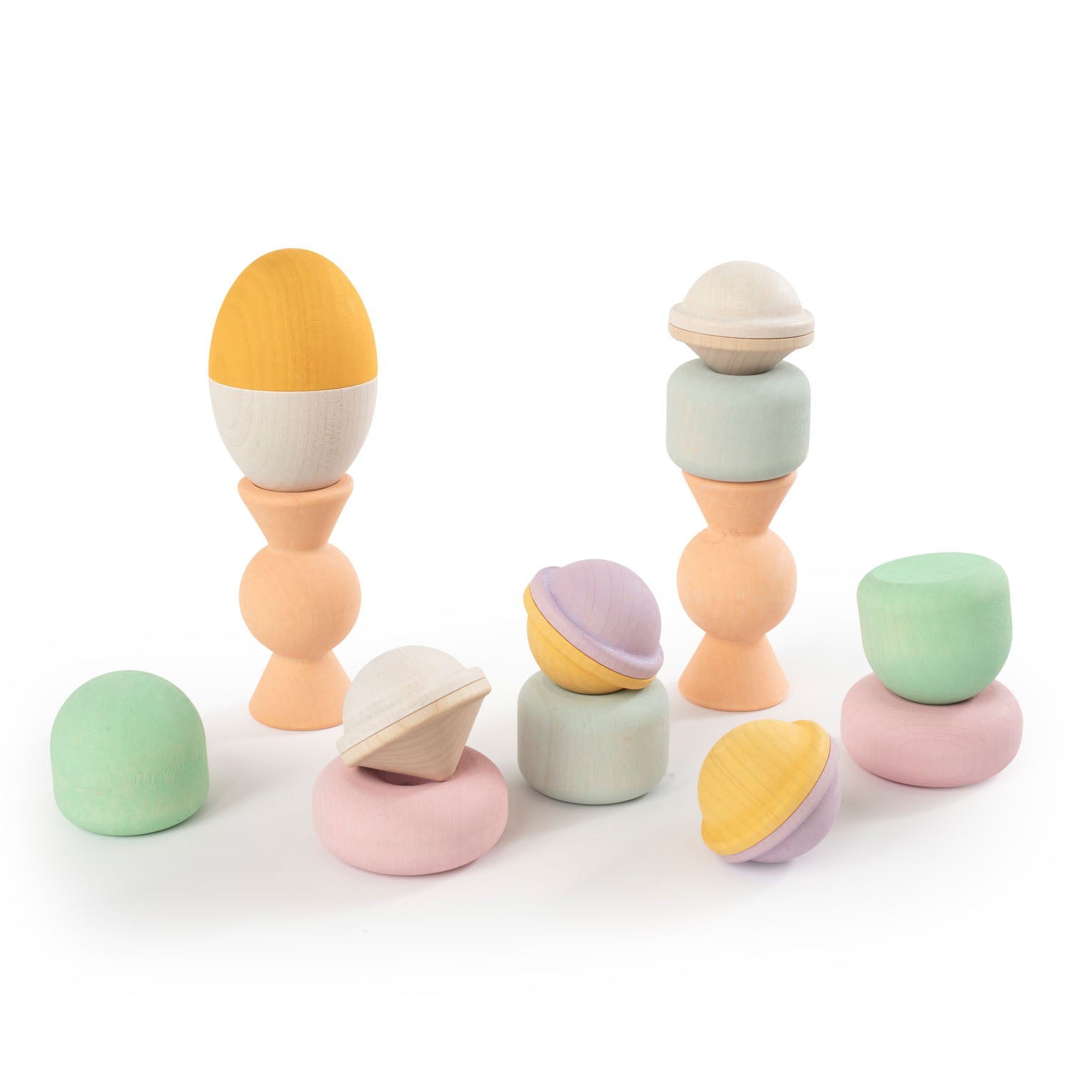 Wooden Chill Pepper Treats stacking and spinning game for ages 3 and up, made from eco-friendly maple wood and non-toxic, water-based paints. The set includes a variety of pastel-colored candy-shaped pieces and a unique Magic Egg for open-ended play.