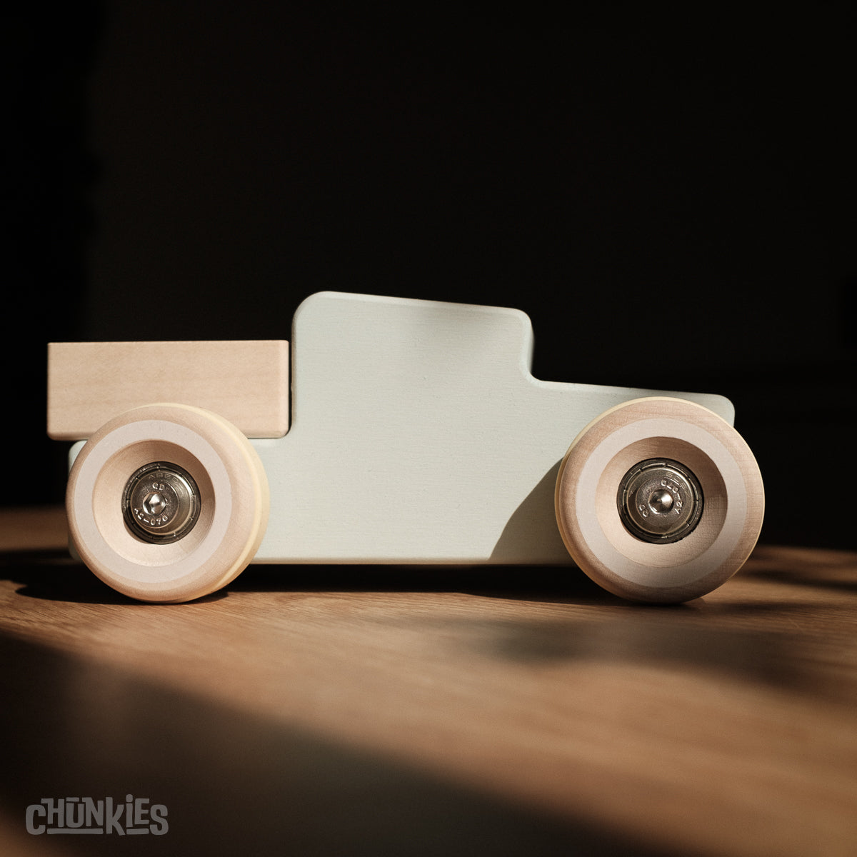 Chunkies: Light blue wooden toy car in the shape of a vintage pick-up truck with wooden wheels, skate bearings and stainless steel hardware. Built to last generations. 