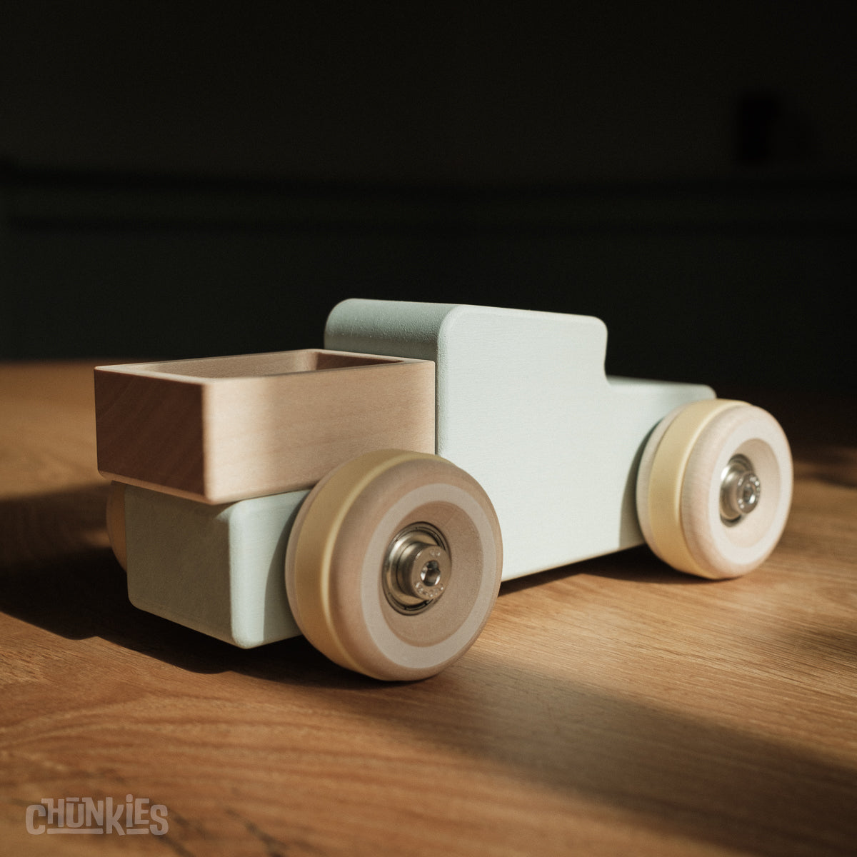 Chunkies: Light blue wooden toy car in the shape of a vintage pick-up truck with wooden wheels, skate bearings and stainless steel hardware. Built to last generations. 
