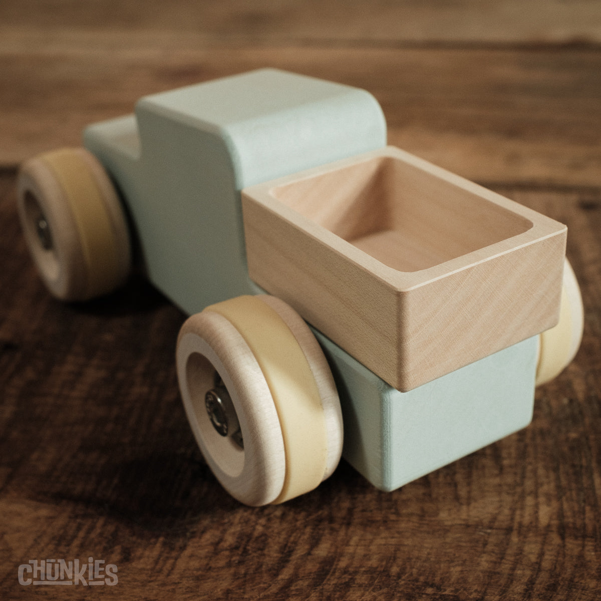 Chunkies: Light blue wooden toy car in the shape of a vintage pick-up truck with wooden wheels, skate bearings and stainless steel hardware. Built to last generations. 