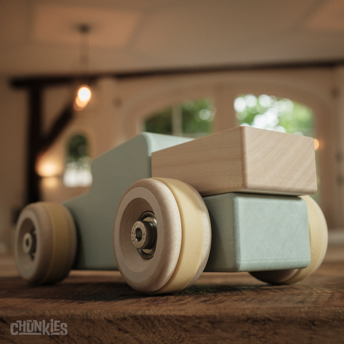 Chunkies: Light blue wooden toy car in the shape of a vintage pick-up truck with wooden wheels, skate bearings and stainless steel hardware. Built to last generations. 