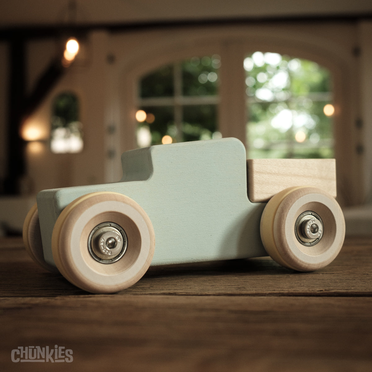 Chunkies: Light blue wooden toy car in the shape of a vintage pick-up truck with wooden wheels, skate bearings and stainless steel hardware. Built to last generations. 