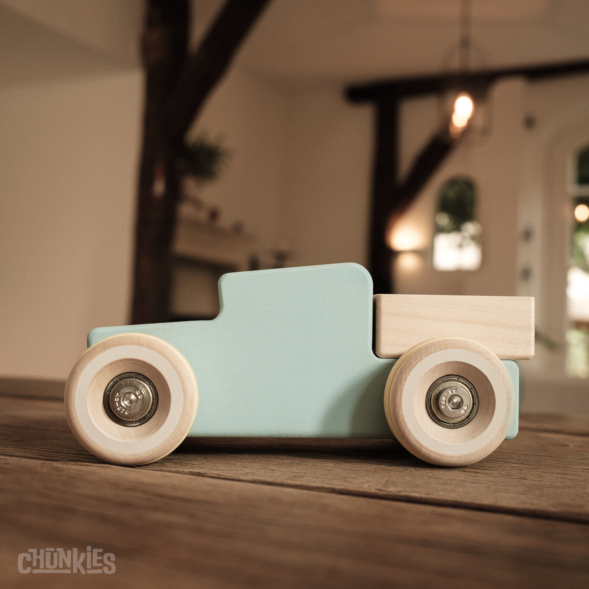 Chunkies: Light blue wooden toy car in the shape of a vintage pick-up truck with wooden wheels, skate bearings and stainless steel hardware. Built to last generations. 