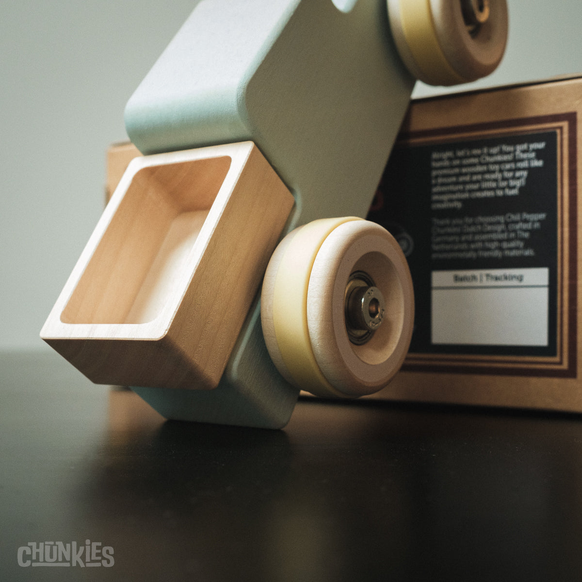 Chunkies: Light blue wooden toy car in the shape of a vintage pick-up truck with wooden wheels, skate bearings and stainless steel hardware. Built to last generations. 
