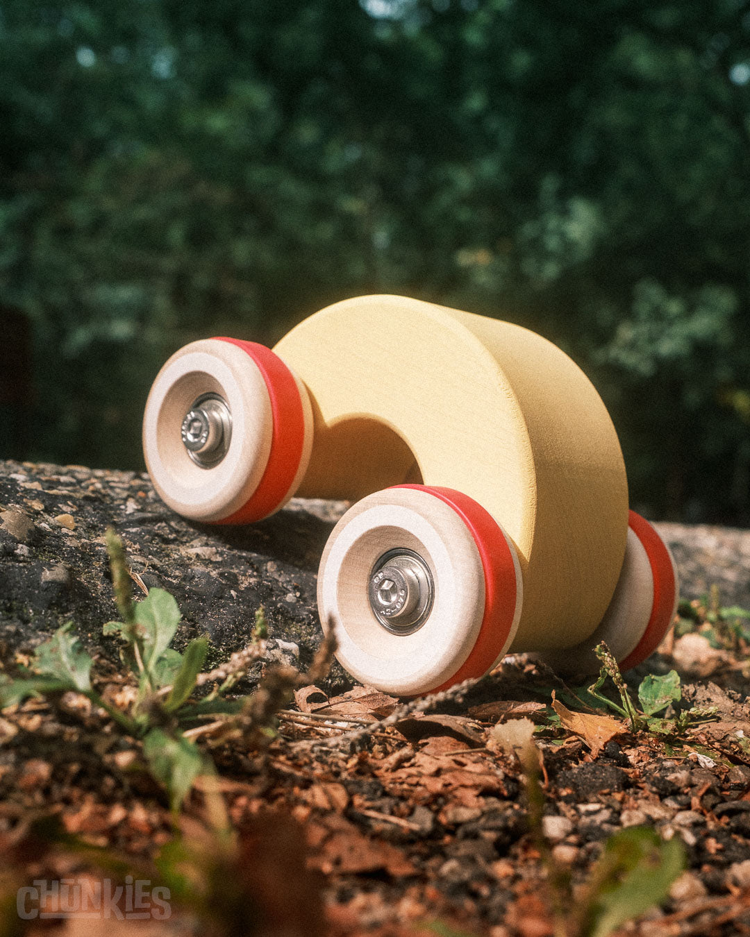 Easy to hold, ready for any adventure: Chill Pepper Chunkies No06 Wooden Toy Car The Rainbow. Here in a forest environment