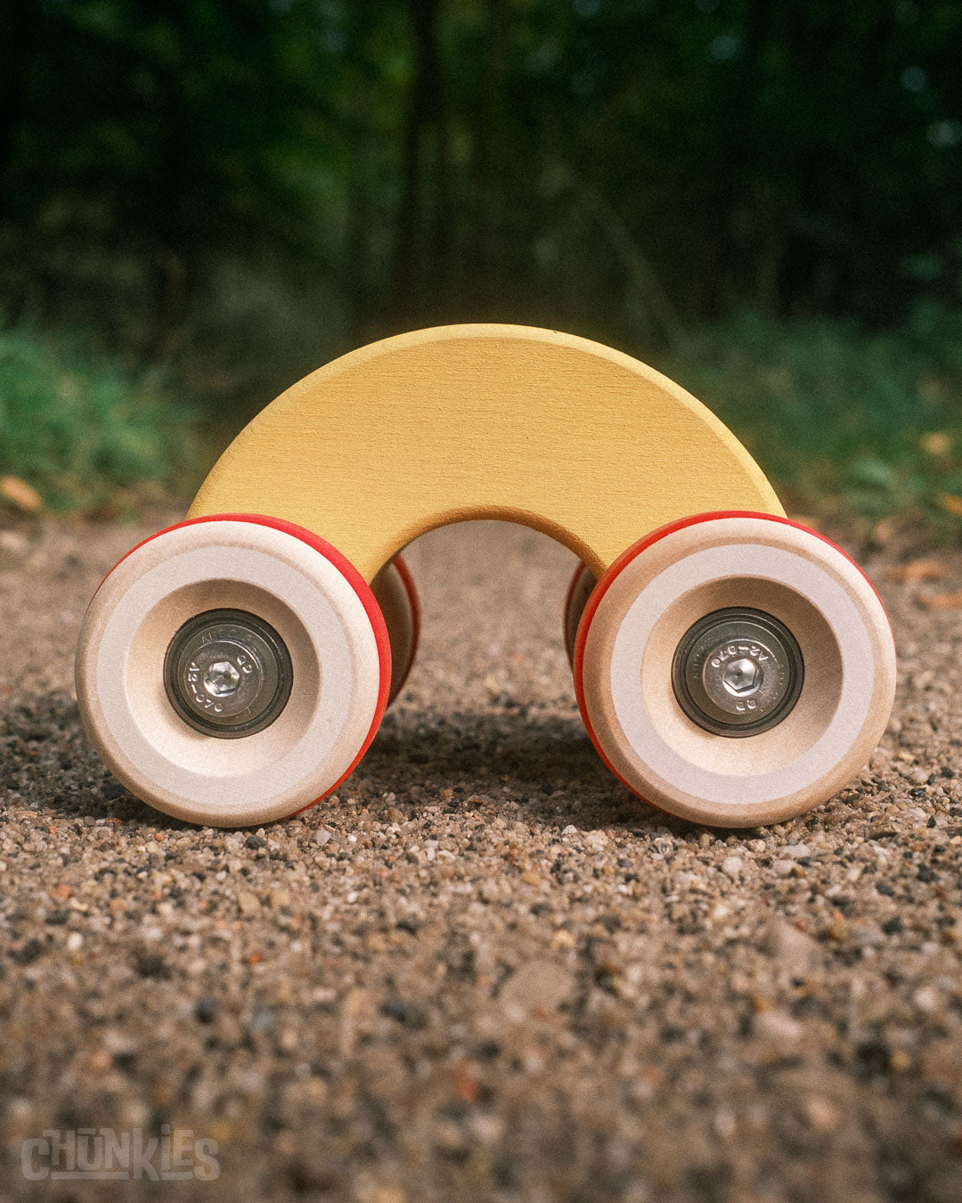 Get a good look at the arch of the Chill Pepper Chunkies No06 Wooden Toy Car The Rainbow. Like with many Waldorf inspired toys this one fits right in. Easy to hold by the smallest of children. No real car shape, which leaves room for imagination. The matte finish and soft wood grain makes this little wonder fun to touch too.