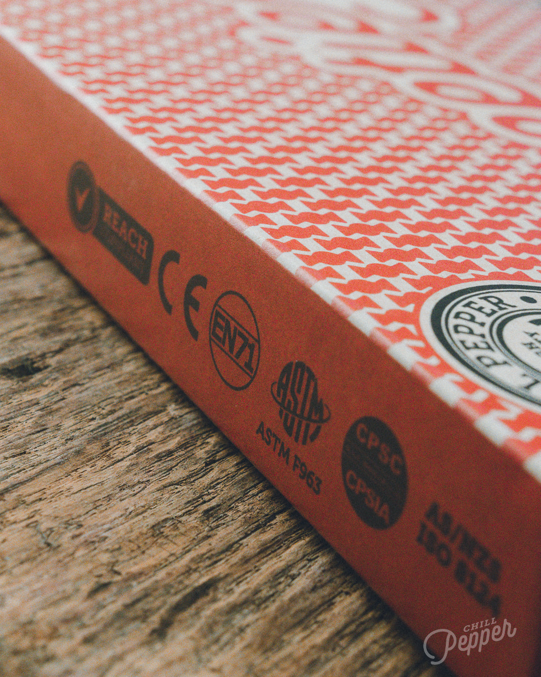 Chill Pepper Sweets Wooden Stacking game -  Closer look at the back of the box showing all safety certifications like CE, EN71, ASTM, CPSIA, AS/NZS and REACH