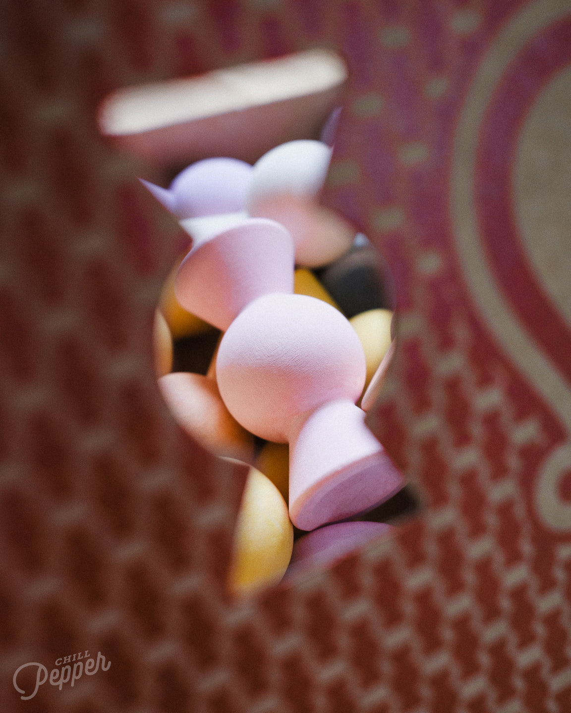 Pink Chill Pepper Sweet as seen through the window of the sustainable carboard box