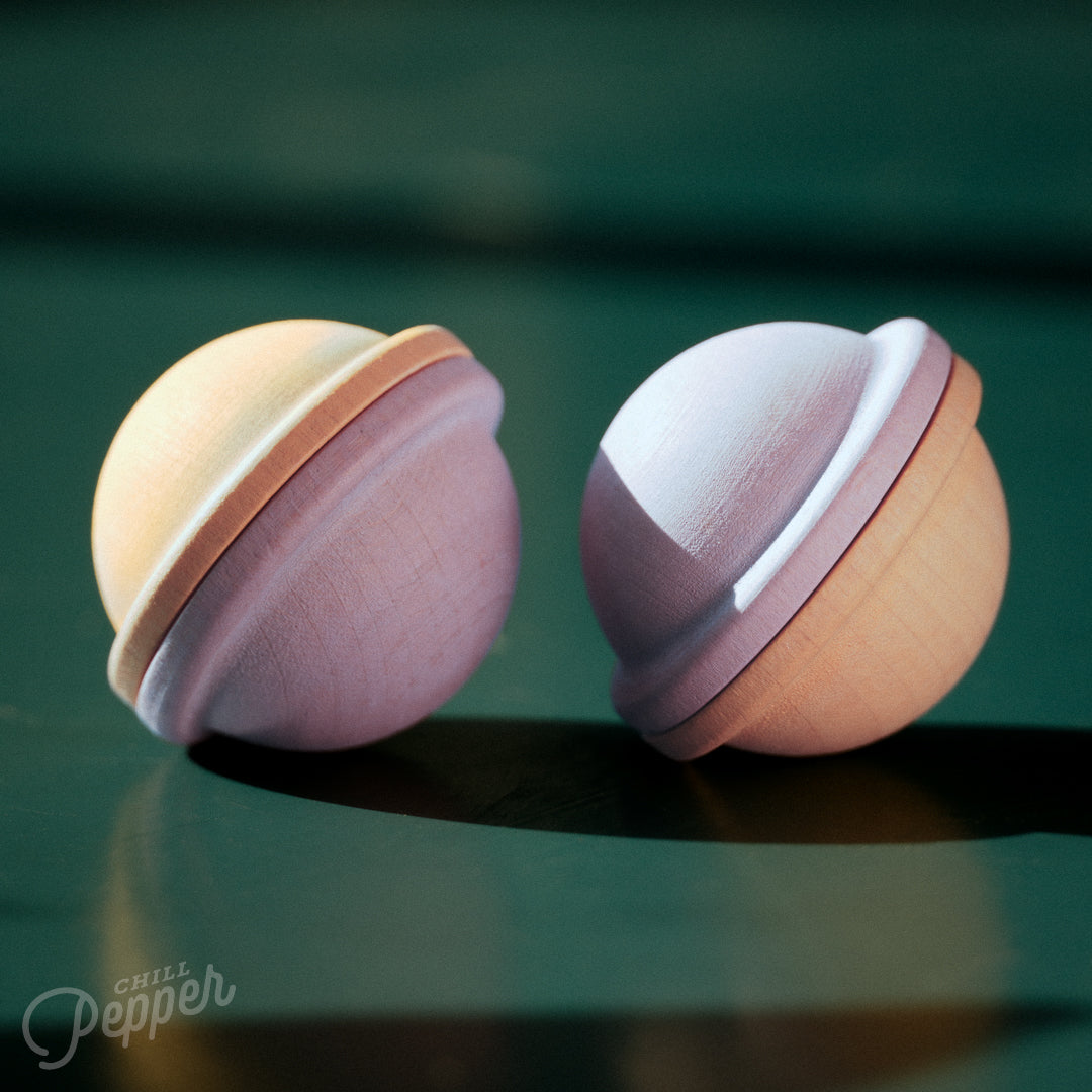 Chill Pepper Treats – Wooden Stacking & Spinning Game - the two lollipops in the set with their pastel purple and yellow soft colors. Made in Europe