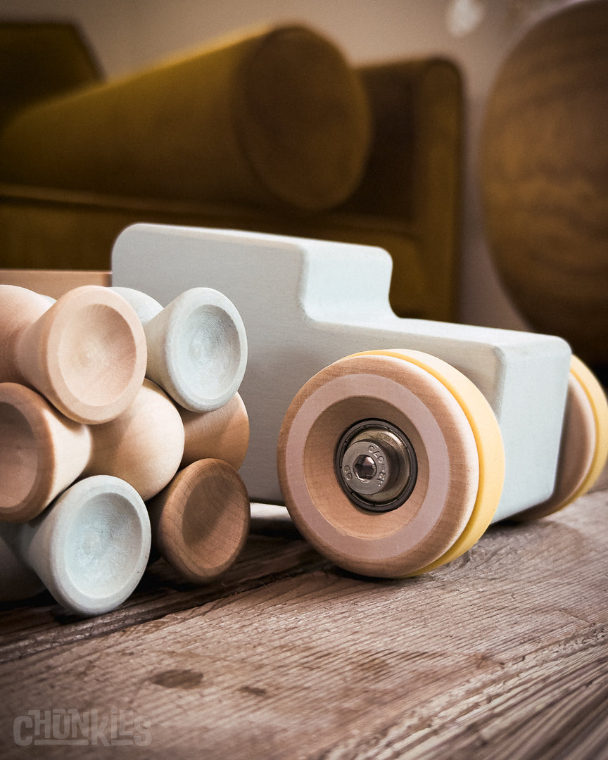 Chunkies: Light blue wooden toy car in the shape of a vintage pick-up truck with wooden wheels, skate bearings and stainless steel hardware. Built to last generations. 